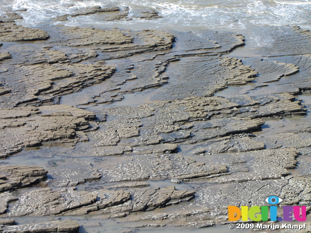 SX05167 Layers of rock slabs at beach